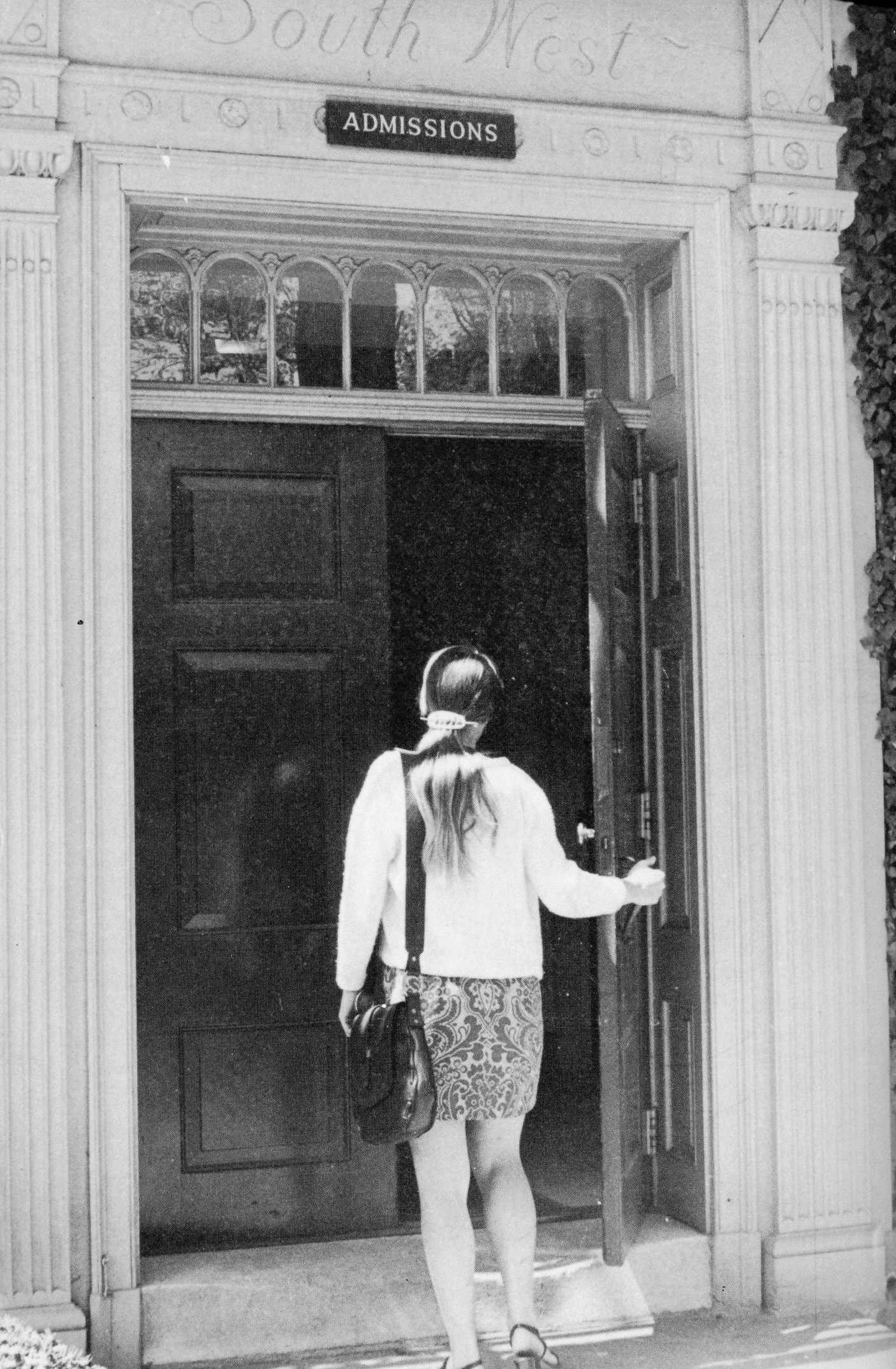 \"Female_student_entering_Admissions_office_1970_NH\"